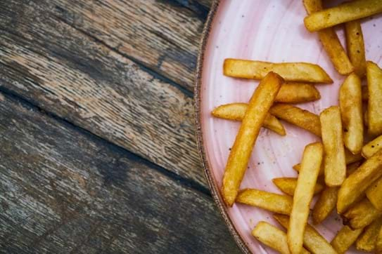 chips on a pink plate